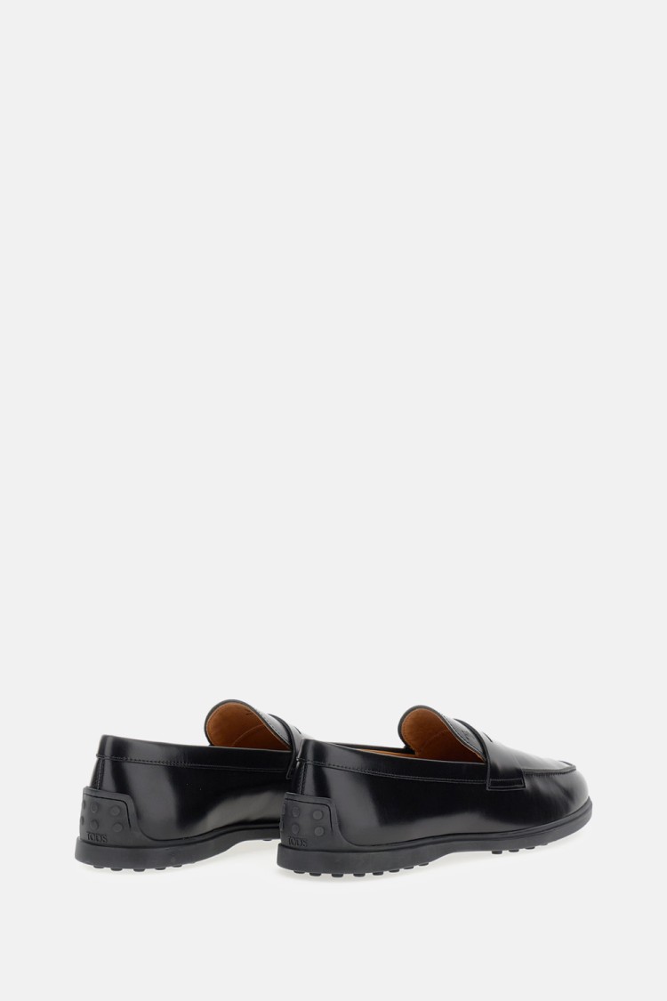 Tod's Calfskin Moccasin With Embossed Monogram And Rubber Gommini Sole In Black