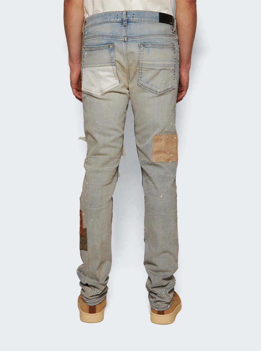Amiri Distressed Stretch Denim Jeans With Faded Effect In Blue