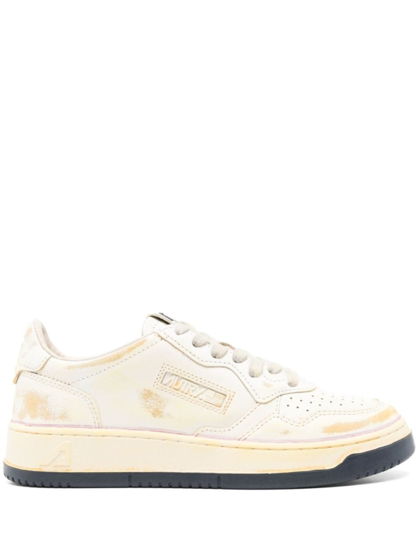 Autry Low-top Sneakers With Distressed Finish And Perforated Detailing In Neutrals