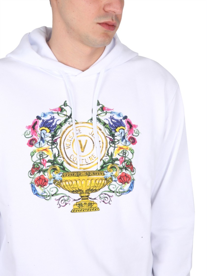 Shop Versace Jeans Couture Drawstring Hooded Sweatshirt With Floral Logo Print In White