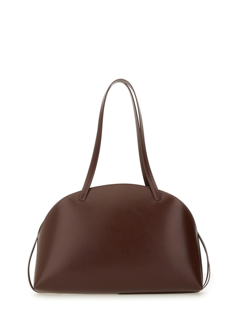 Jil Sander 'curve Medium' Brown Shoulder Bag With Embossed Logo On The Front And Curved Design In Brown