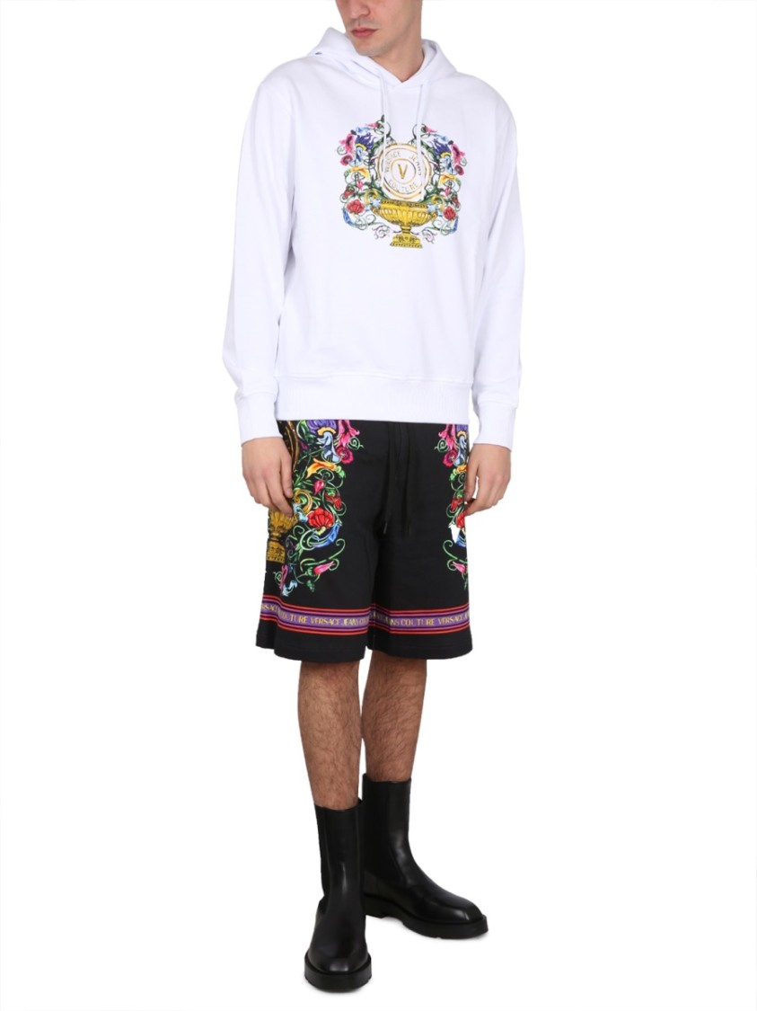 Shop Versace Jeans Couture Drawstring Hooded Sweatshirt With Floral Logo Print In White