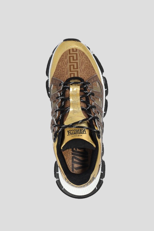 Versace Gold Trigreca Sneakers in Gold | THE LIST