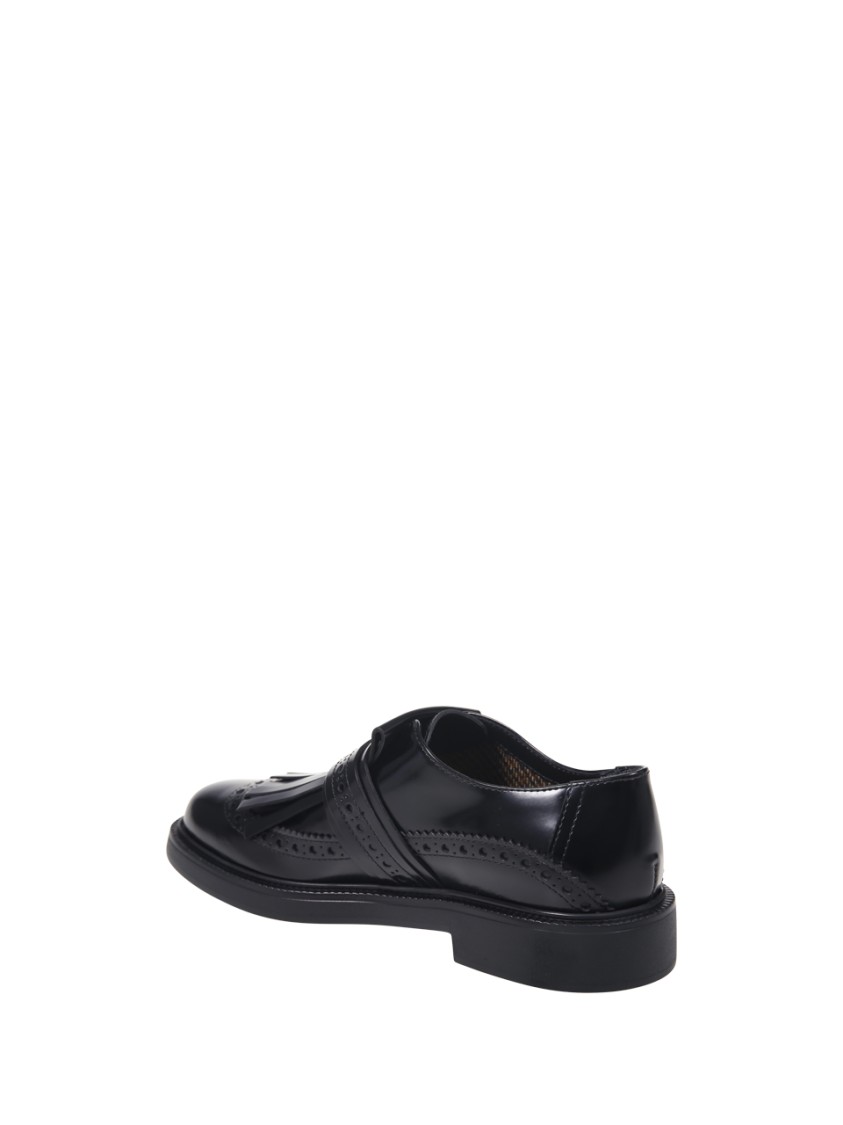 Tod's 20l Loafer With Rounded Toe And Decorative Buckle Strap In Black