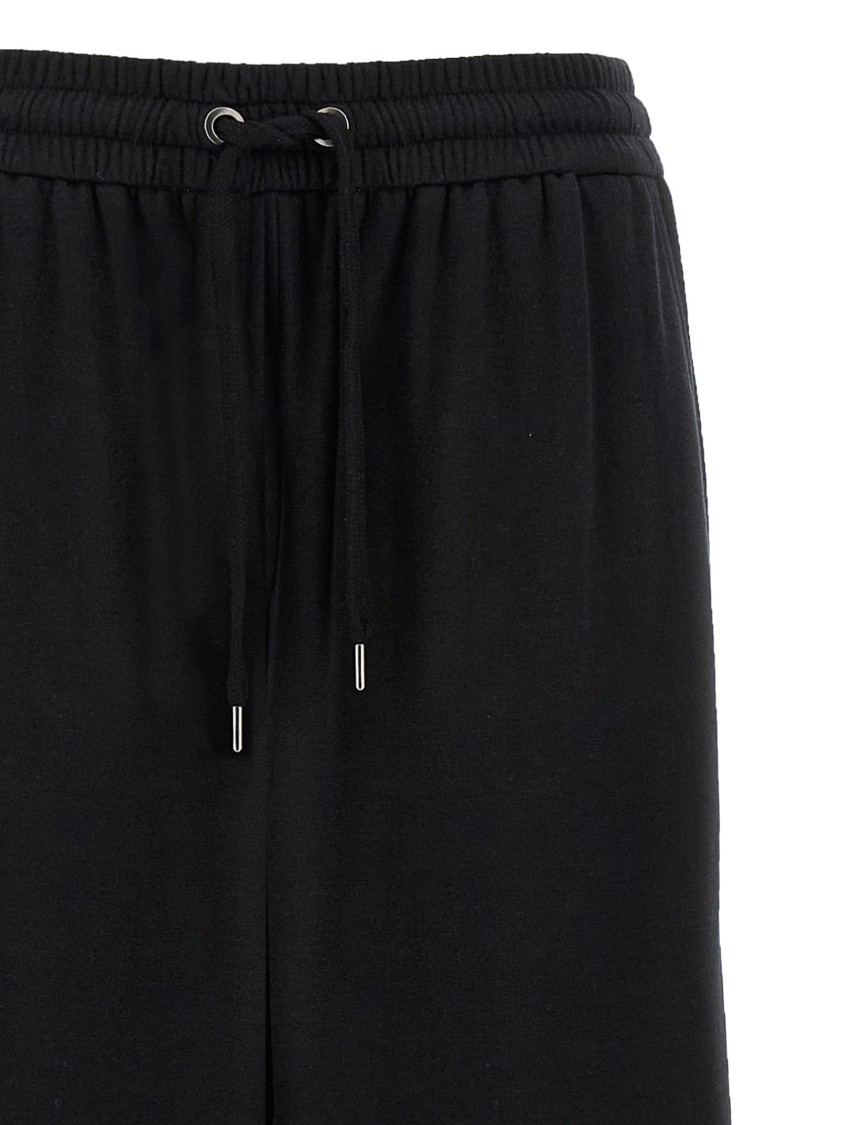 Brunello Cucinelli Shiny Trims Joggers With Back And Side Pockets In Black