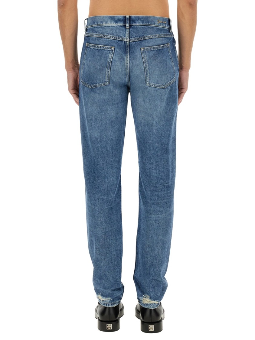Givenchy Washed Denim Tapered Leg Jeans With Contrast Stitching