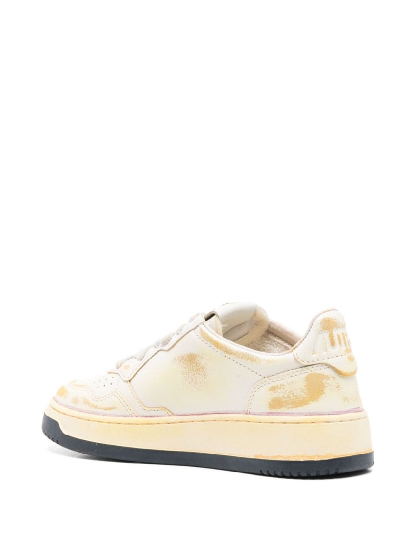 Autry Low-top Sneakers With Distressed Finish And Perforated Detailing In Neutrals