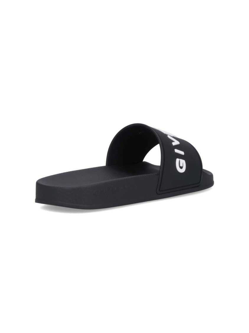 Givenchy Black Logo Embossed Slides In Black