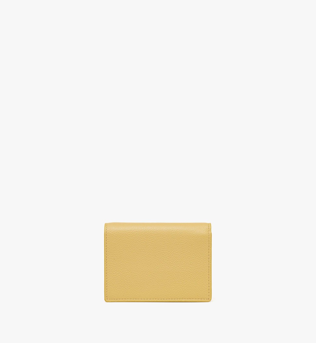 Mcm Embossed Leather Wallet With Noble Wreath Motif In Gold