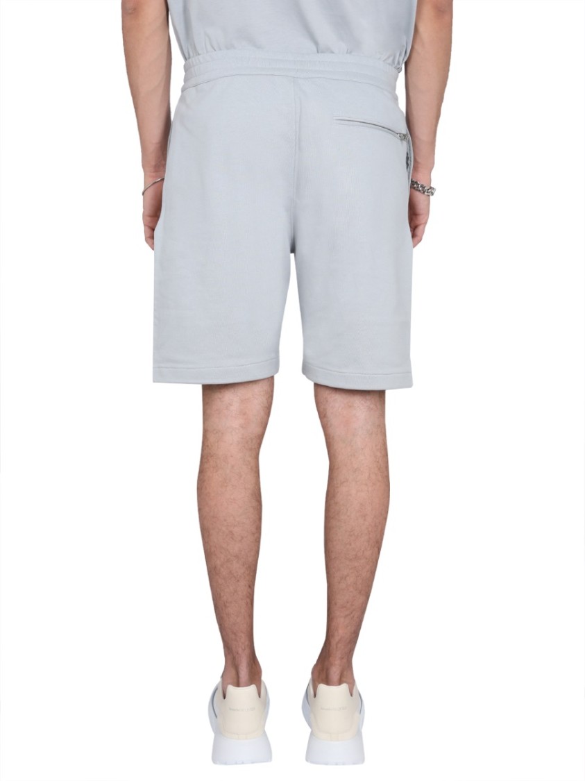 Alexander Mcqueen Men Bermuda Shorts With Graffiti Logo Print In Blue