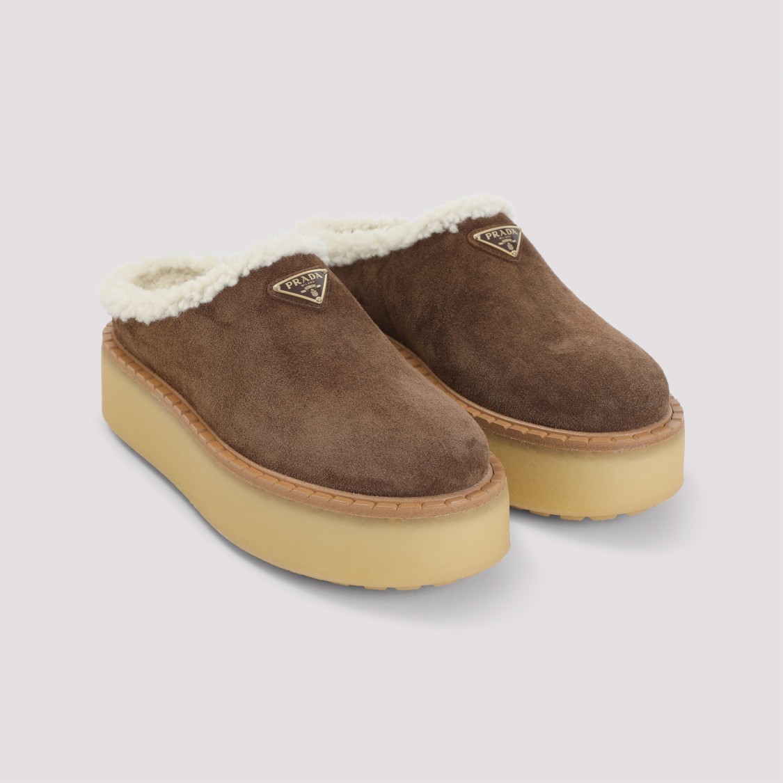 Prada Brown Suede Mules With Shearling Trim And Plush Lining In Blue