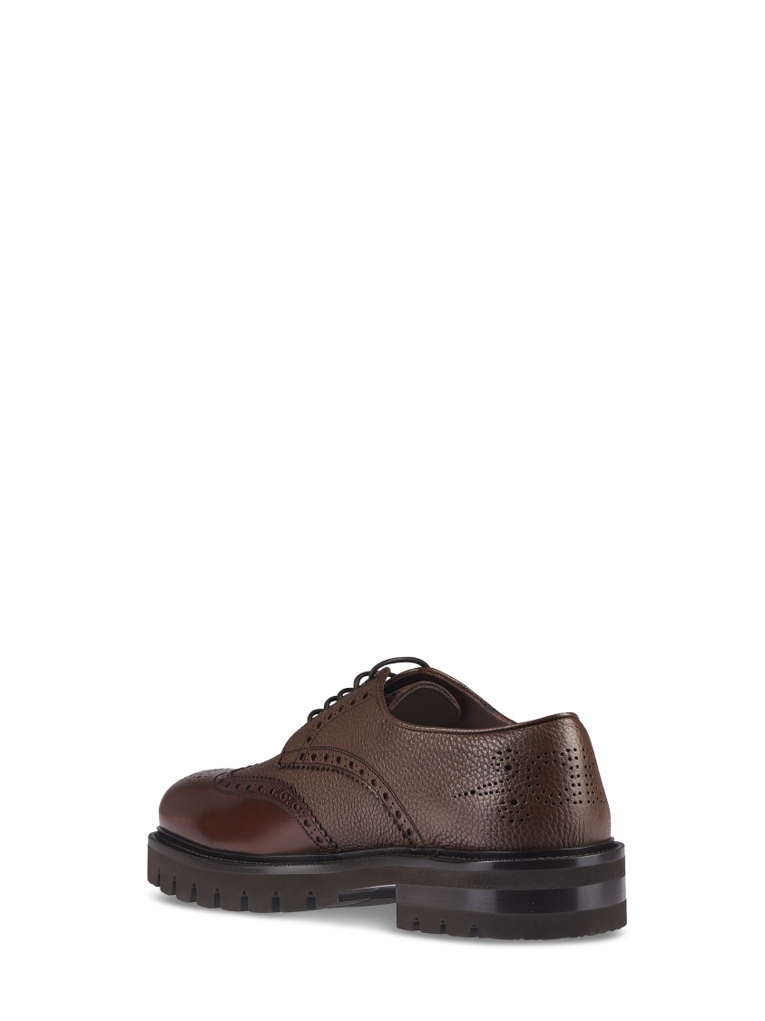 Ferragamo Brogue Leather Flat Shoes With Intricate Perforations In Black