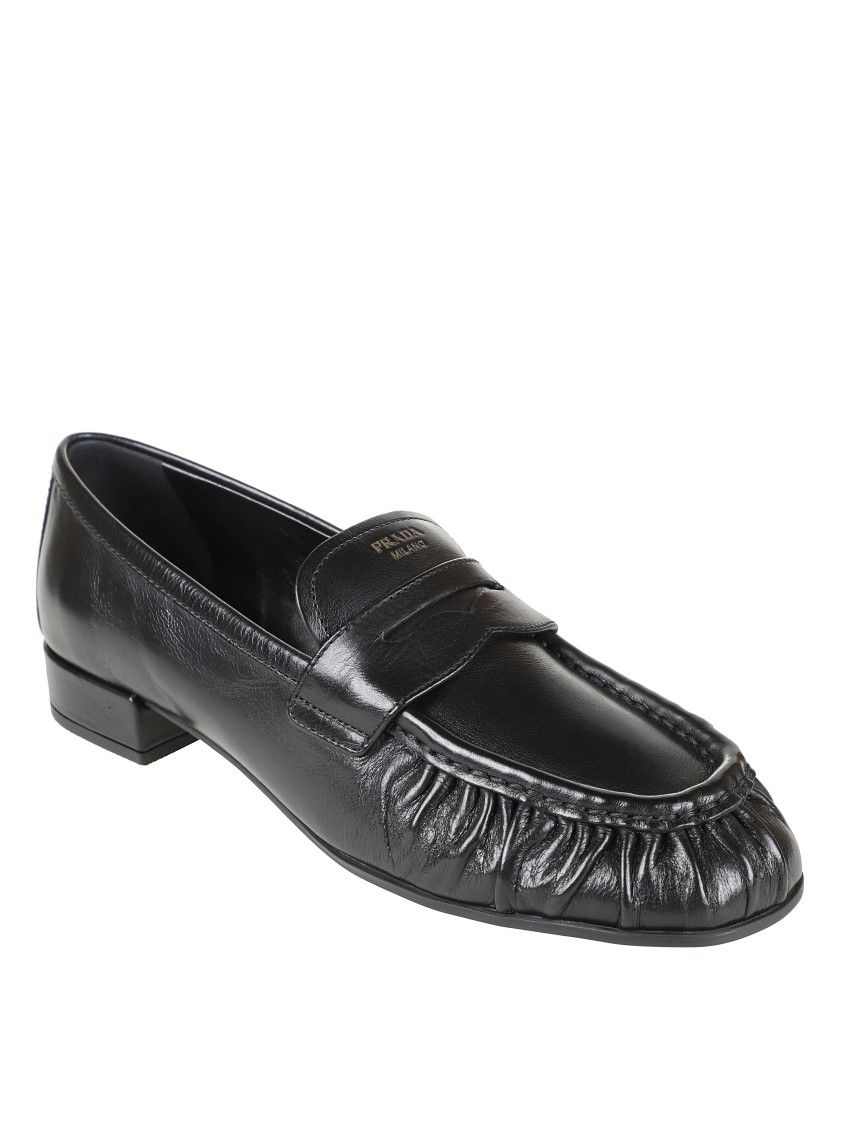 Prada Rounded Toe Loafers With Textured Detailing And Low Block Heel In Black