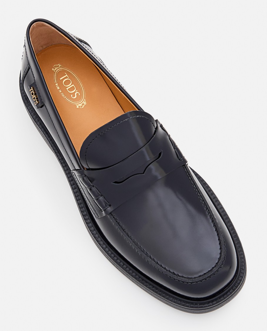 Tod's Mustard Gomma 20l Moccasins With Grommet-accented Heel In Black