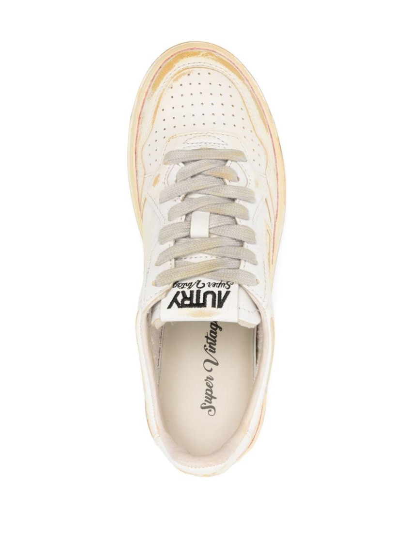 Autry Low-top Sneakers With Distressed Finish And Perforated Detailing In Neutrals