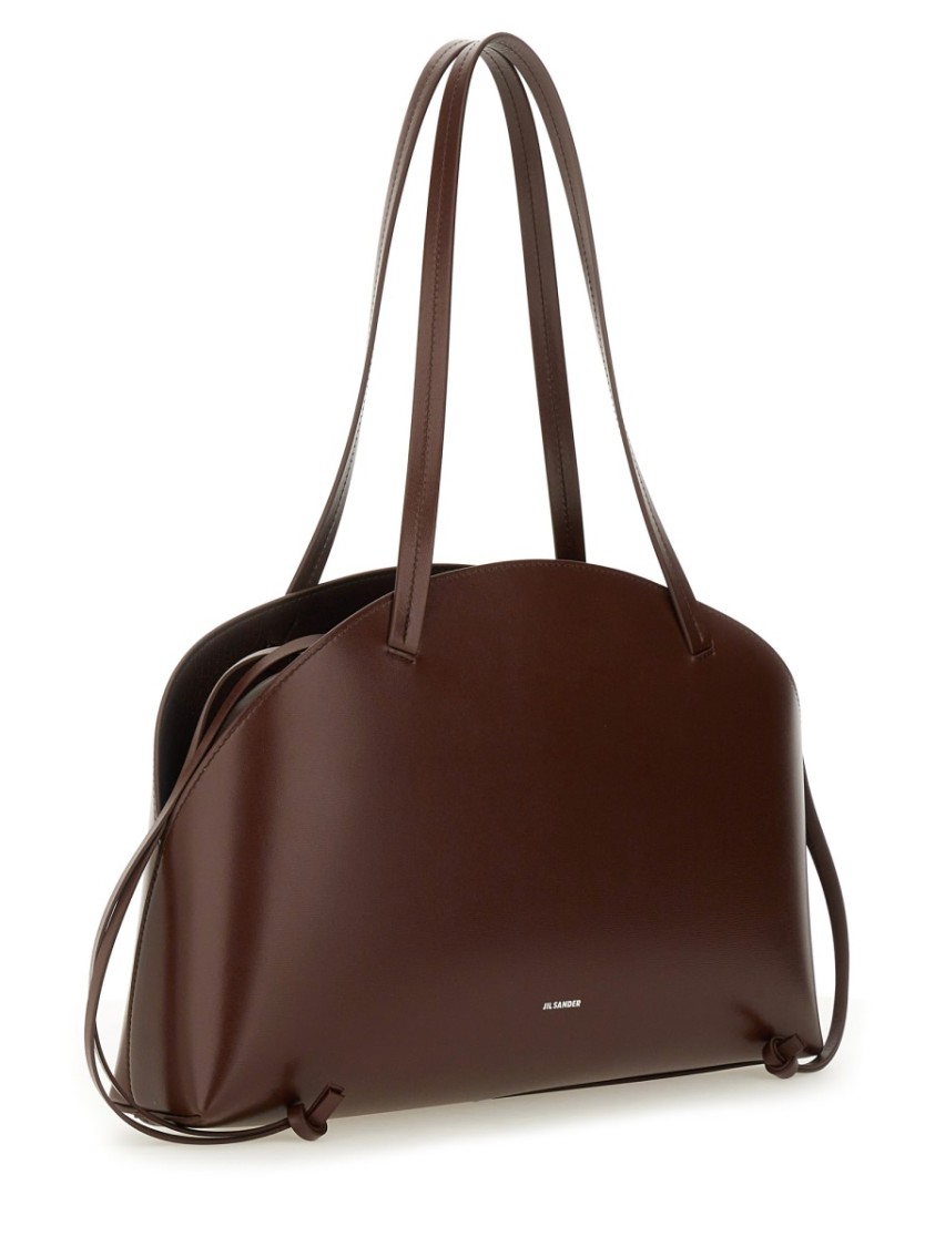 Jil Sander 'curve Medium' Brown Shoulder Bag With Embossed Logo On The Front And Curved Design In Brown
