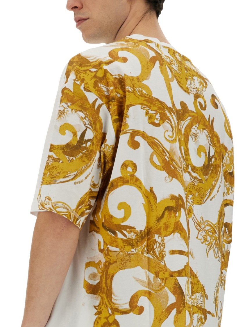 Shop Versace Jeans Couture Oversized T-shirt With Bold Logo And Intricate Patterned Sleeves In White