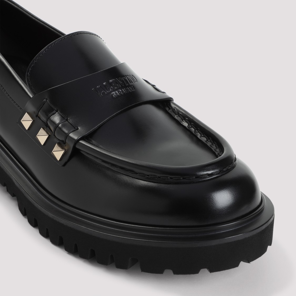 Shop Valentino Black Leather Loafers With Gold-studded Accents