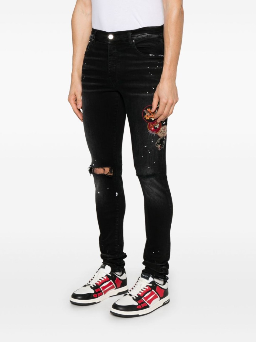 Shop Amiri Slim Fit Black Distressed Jeans With Colorful Patches
