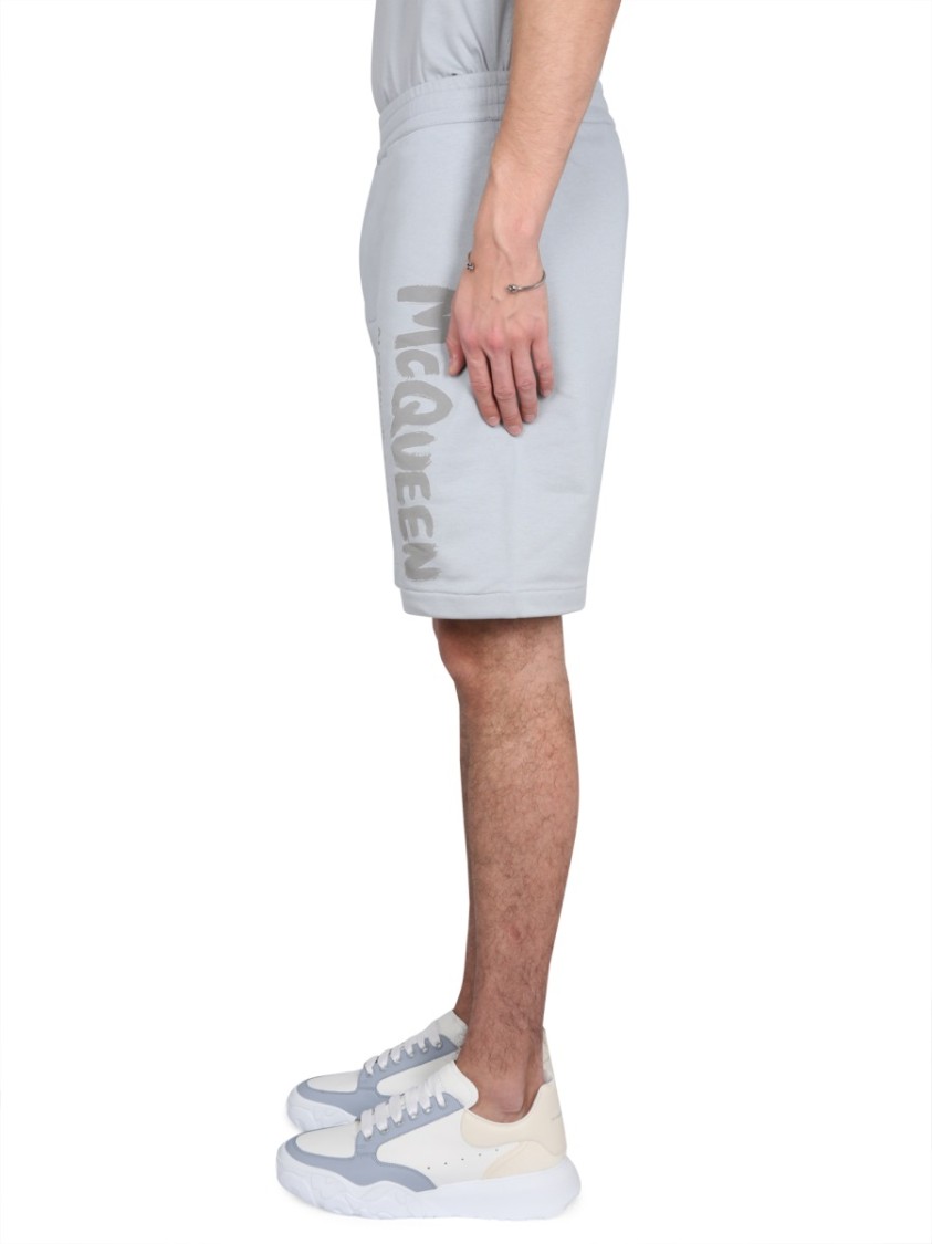 Alexander Mcqueen Men Bermuda Shorts With Graffiti Logo Print In Blue