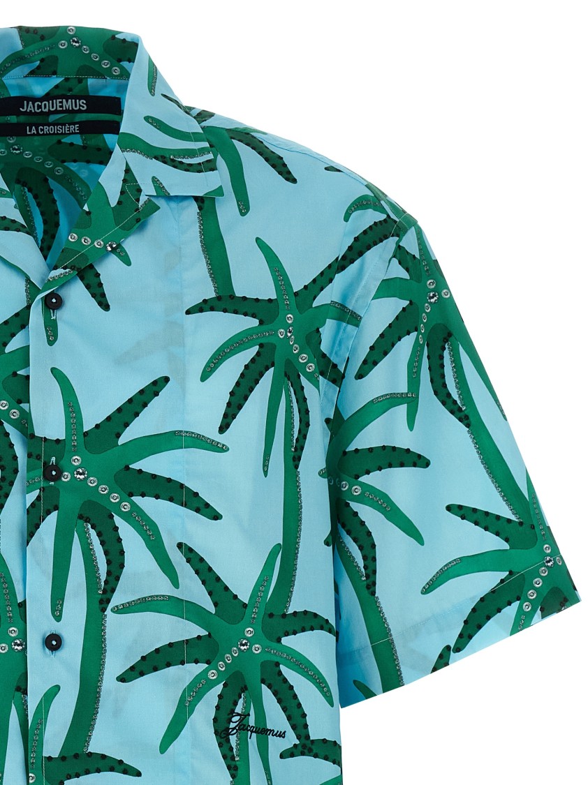 Jacquemus 'la Chemise Jean' Light Blue Shirt With Notched Collar And All-over Palm Tree Print In Blue