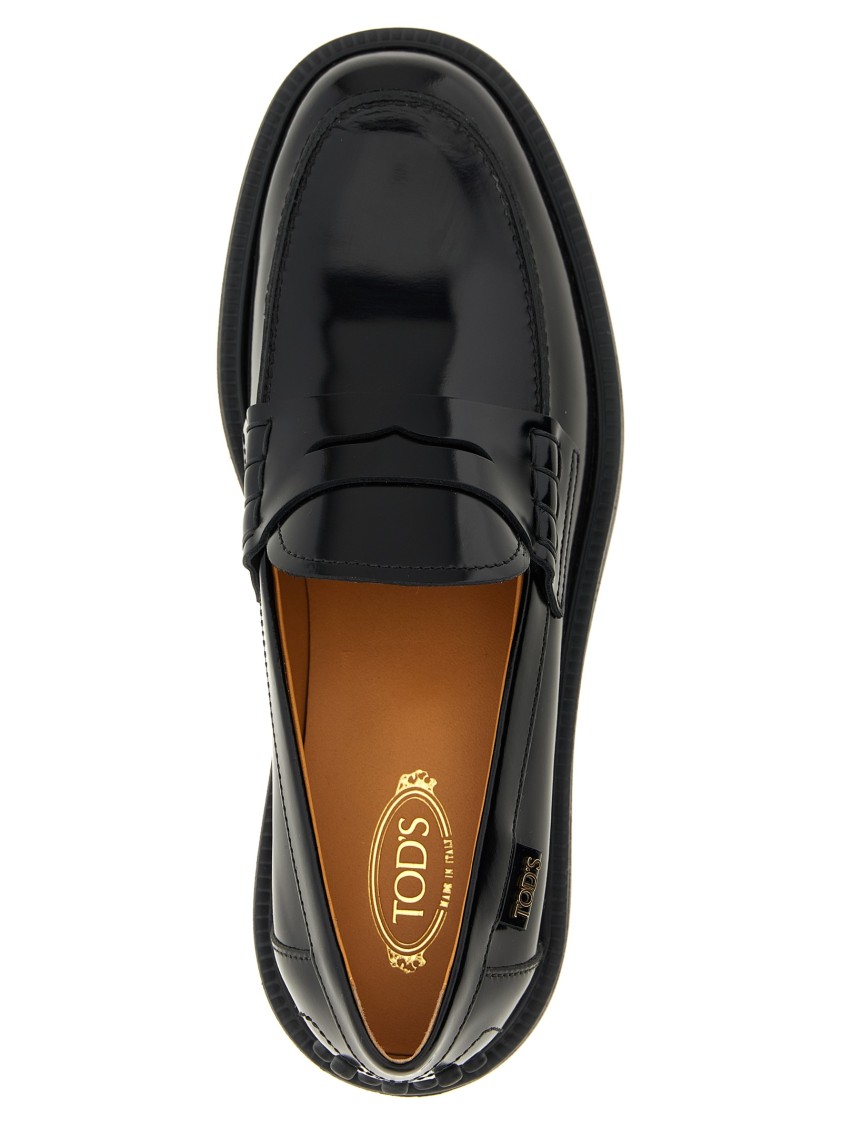 Tod's Mustard Gomma 20l Moccasins With Grommet-accented Heel In Black