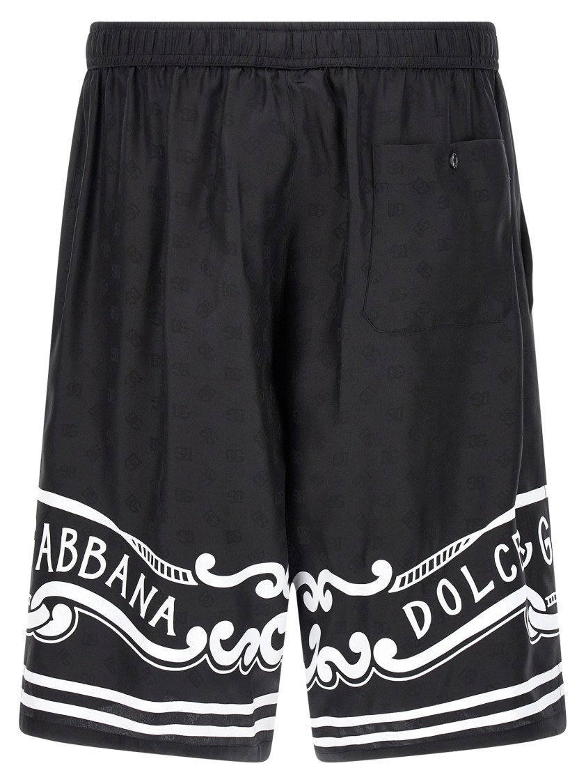 Dolce & Gabbana Black Bermuda Pants With Drawstring Elastic Waist And Maxi Print In Silk Man In Black