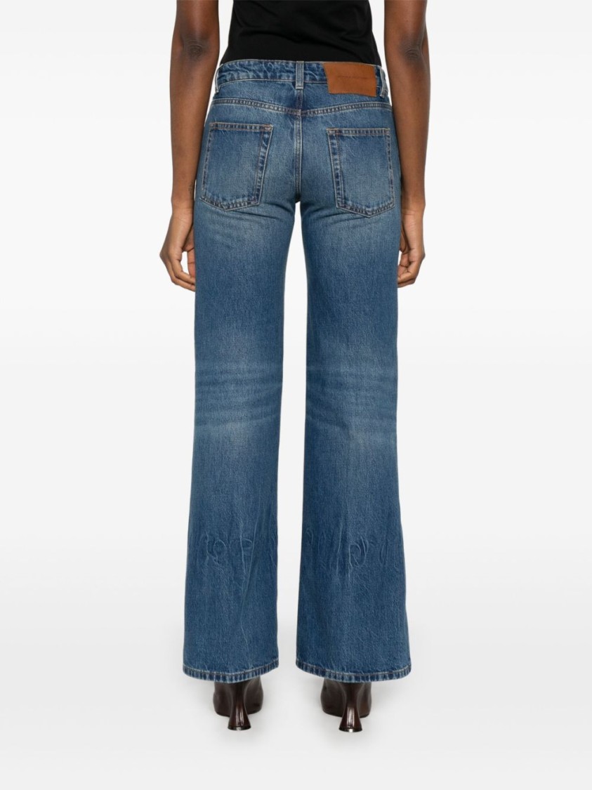 Shop Victoria Beckham Flared Denim Jeans With Mid-rise Waist