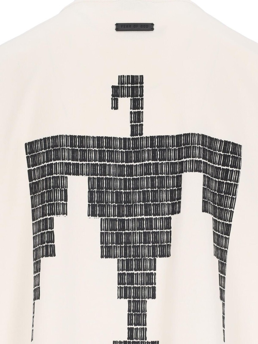 FEAR OF GOD FEAR OF GOD THUNDERBIRD LOGO T-SHIRT IN CREAM COTTON 