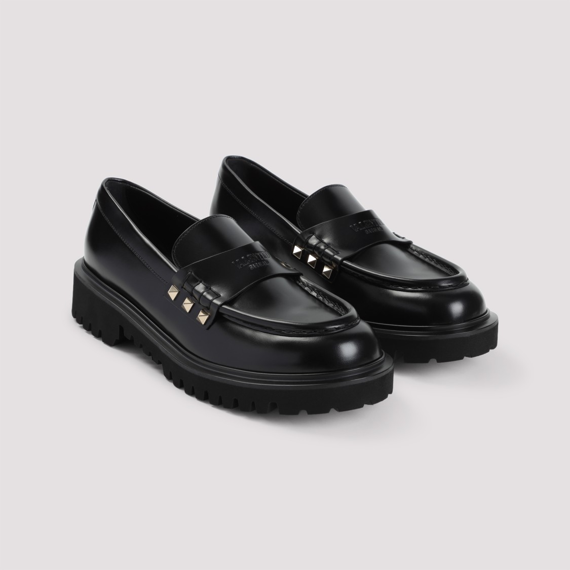 Shop Valentino Black Leather Loafers With Gold-studded Accents
