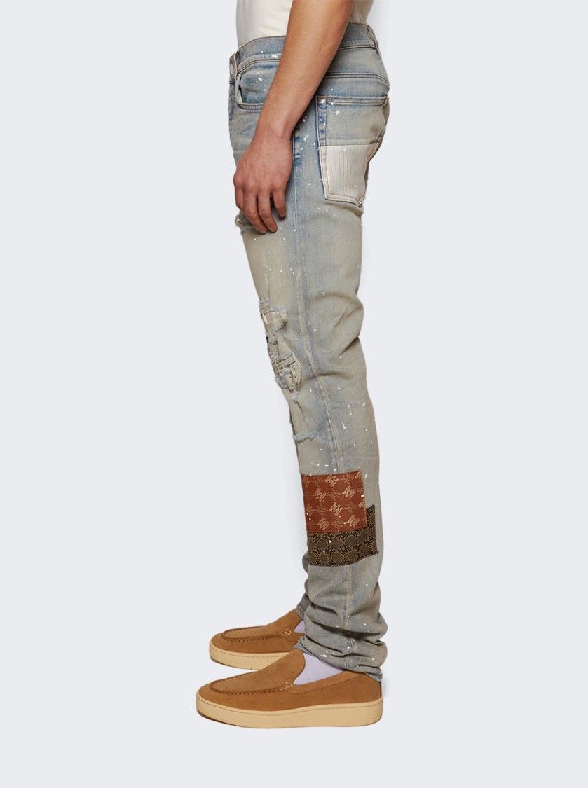 Amiri Distressed Stretch Denim Jeans With Faded Effect In Blue