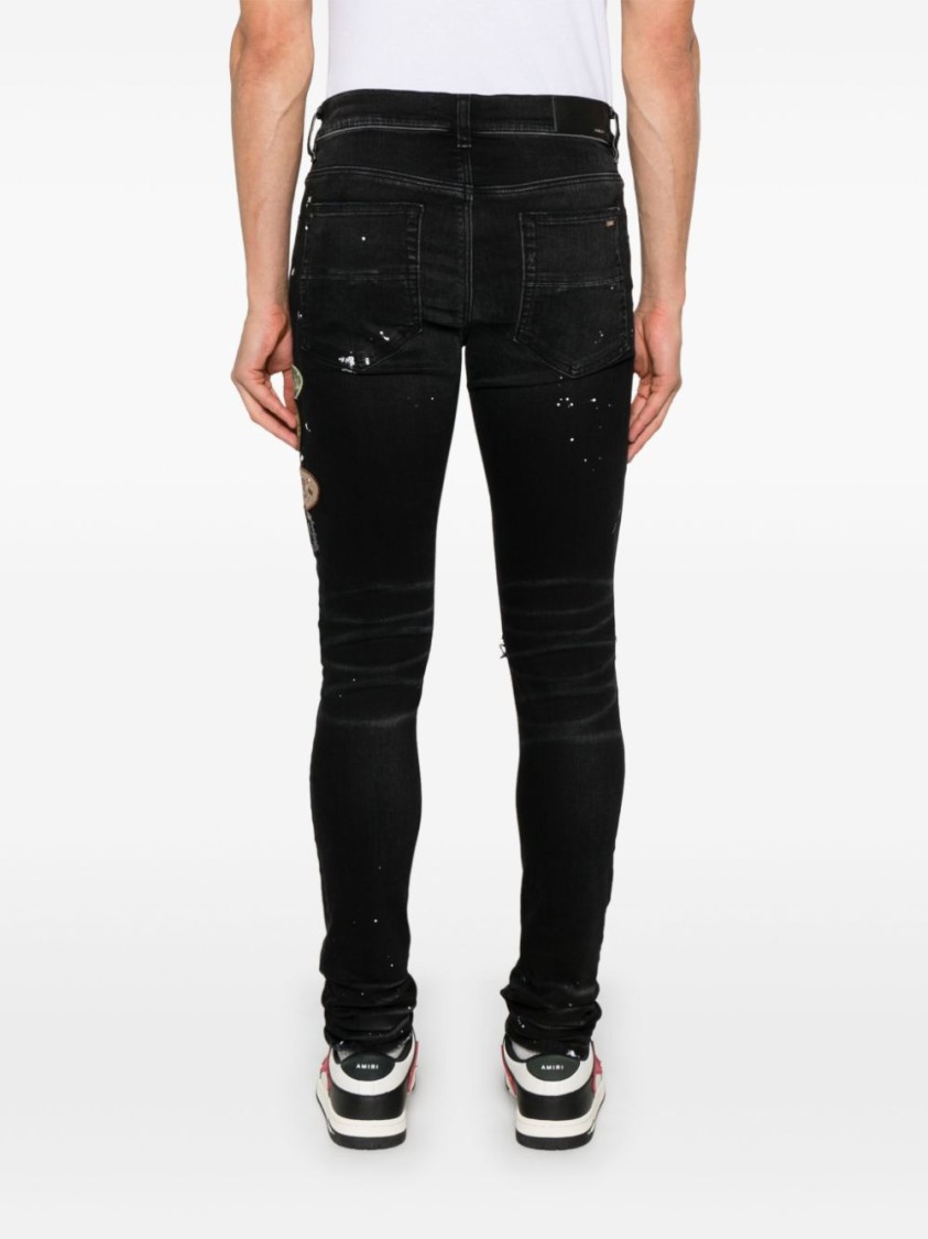 Shop Amiri Slim Fit Black Distressed Jeans With Colorful Patches