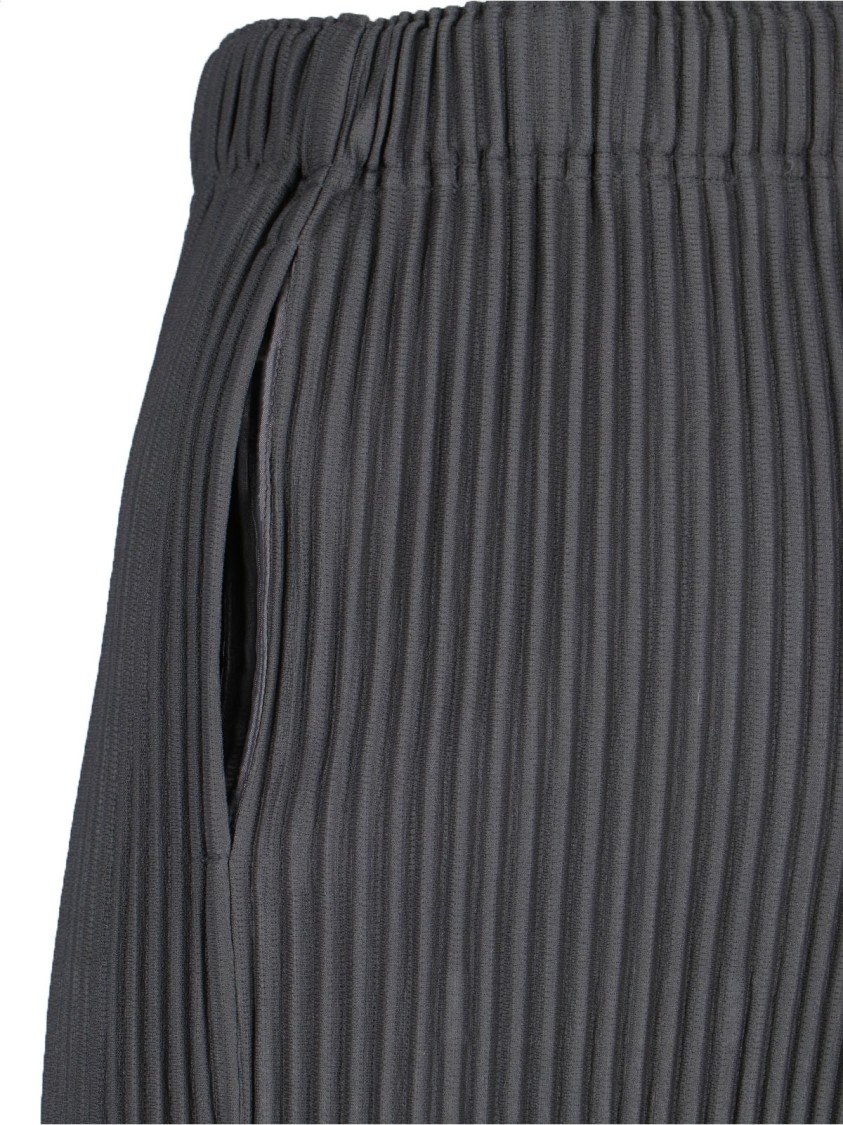 ISSEY MIYAKE HOMME PLISSÉ ISSEY MIYAKE HIGH-WAISTED GREY PLEATED TROUSERS WITH DRAWSTRING CLOSURE