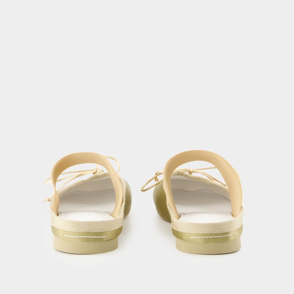 Shop Mm6 Maison Margiela Mm6 By Maison Margiela Mules With Decorative Bow Detail In Yellow