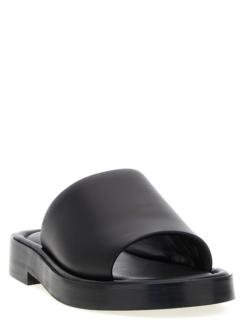 Ferragamo Logo Embossed Leather Slides In Black
