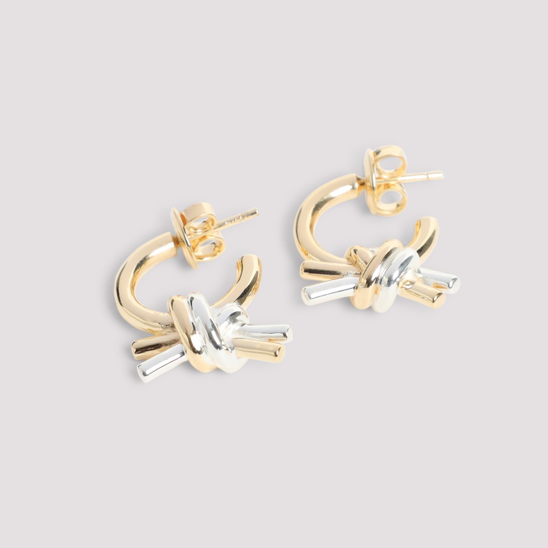 Bottega Veneta Intertwined Brass Hoop Earrings With Decorative Knot In Gold