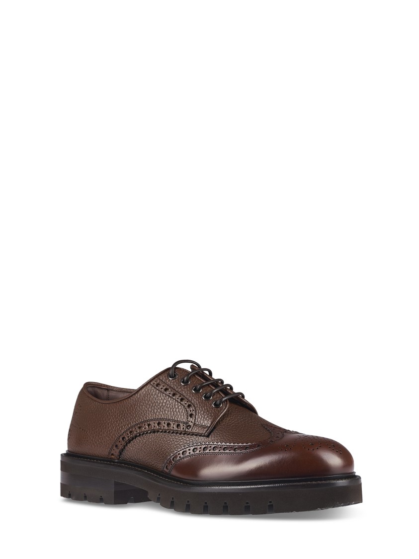 Ferragamo Brogue Leather Flat Shoes With Intricate Perforations In Black