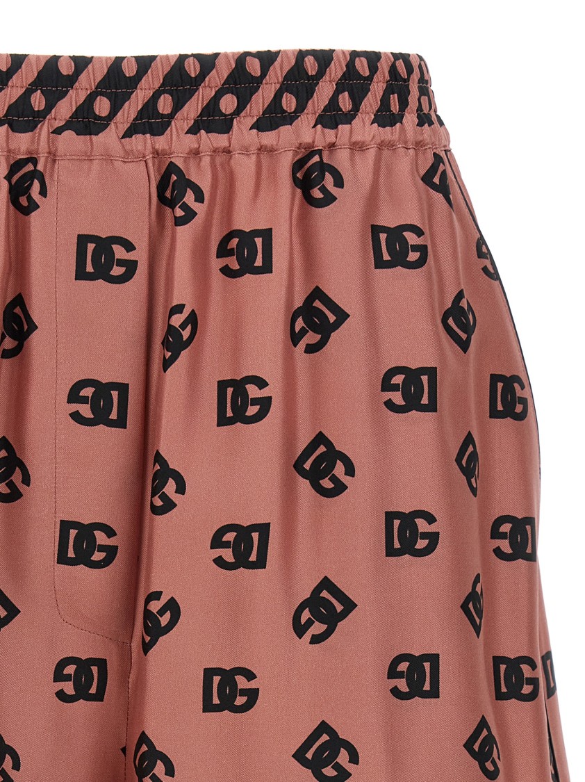 Dolce & Gabbana Pink Bermuda Shorts With Dg Logo Printed All-over In Neutral