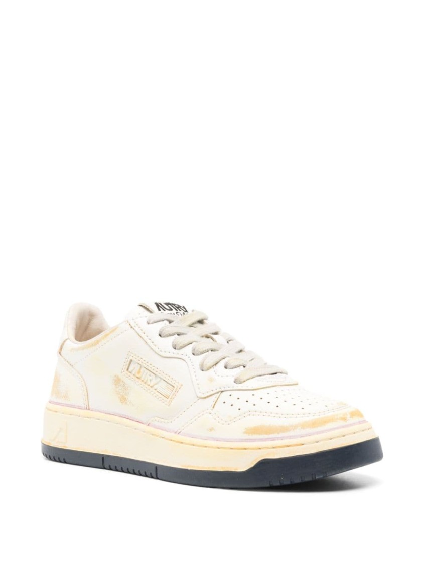 Autry Low-top Sneakers With Distressed Finish And Perforated Detailing In Neutrals