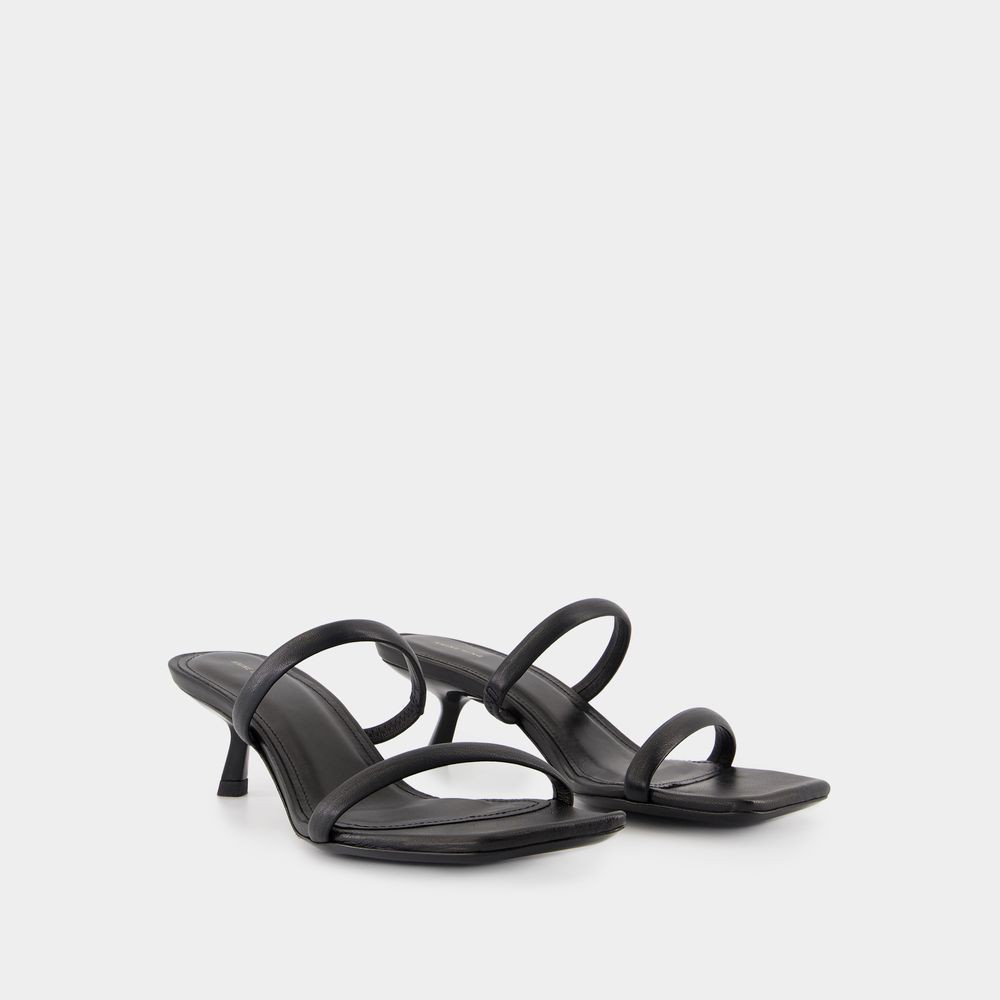Shop Anine Bing Sleek Black Calfskin Mules With Curved Heel