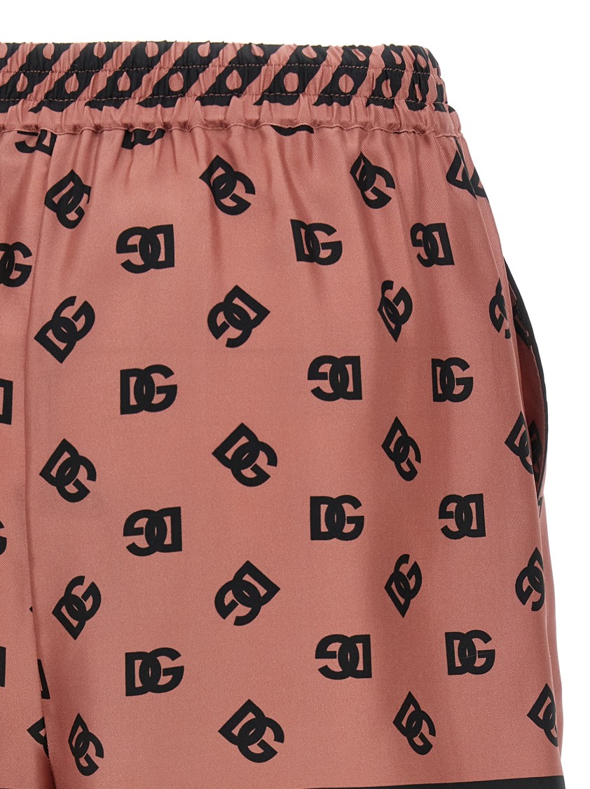 Dolce & Gabbana Pink Bermuda Shorts With Dg Logo Printed All-over In Neutral
