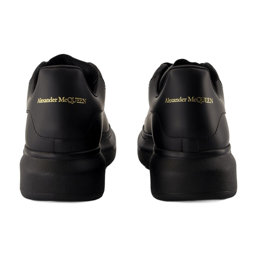 Alexander Mcqueen Black Sneakers With Logo Lettering On The Rear And Oversize Rubber Sole In Leather