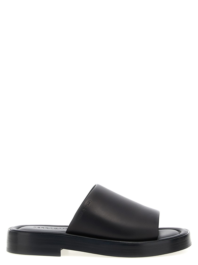 Ferragamo Logo Embossed Leather Slides In Black