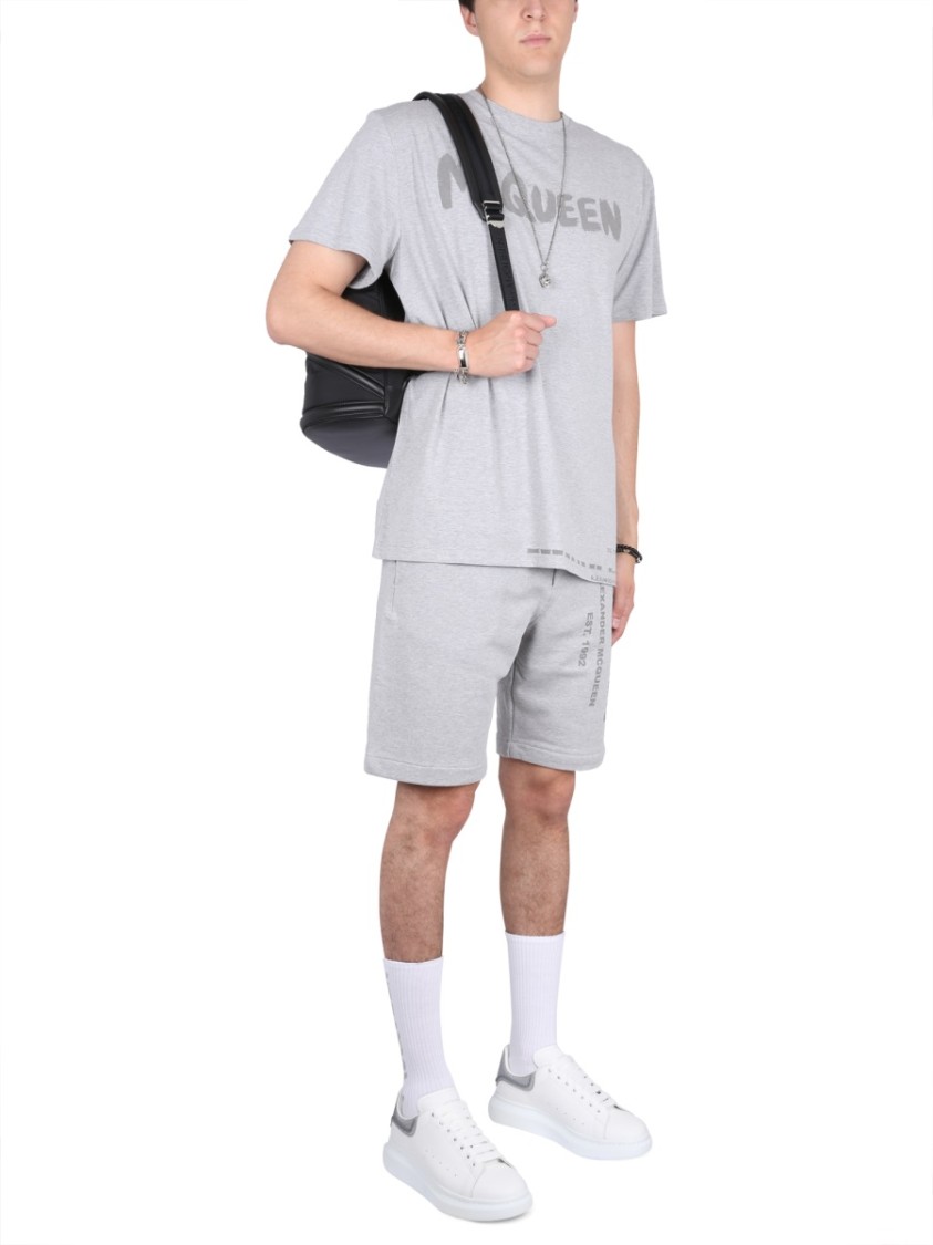 Alexander Mcqueen Men Bermuda Shorts With Graffiti Logo Print In Grey