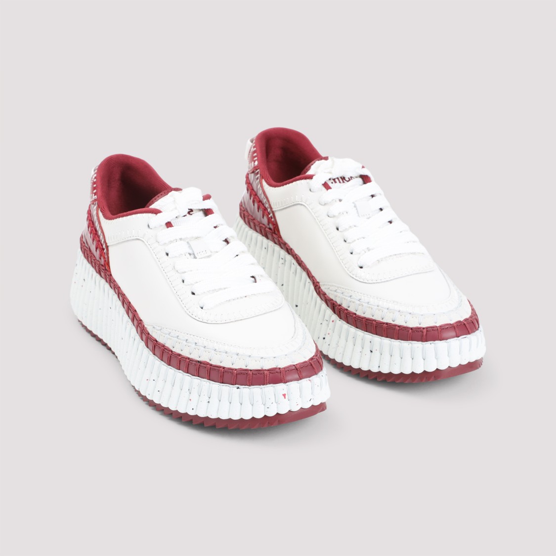 Shop Chloé Red Leather Sneakers With Textured Sole And Elegant Accents