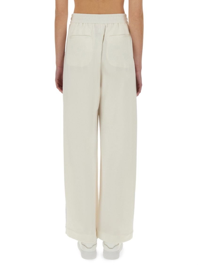 BRUNELLO CUCINELLI BRUNELLO CUCINELLI WIDE-FIT TRACK PANTS WITH ELEGANT SIDE DETAILING