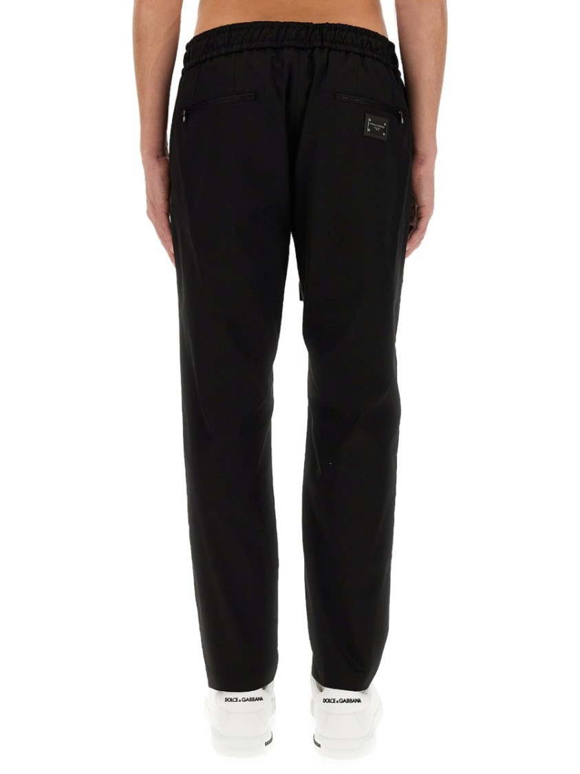 Dolce & Gabbana Jogging Pants With Plaque Detail In Black