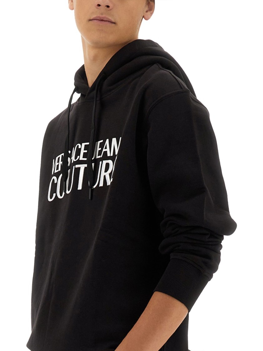 Shop Versace Jeans Couture Black Regular Fit Sweatshirt With Bold Logo Print