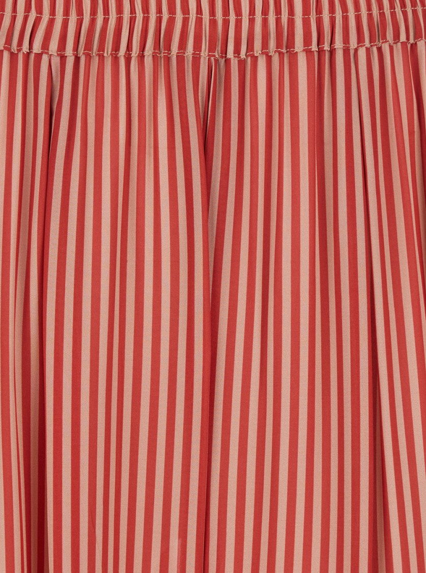 MERCI MERCI RED PANTS WITH ALL-OVER STRIPED MOTIF