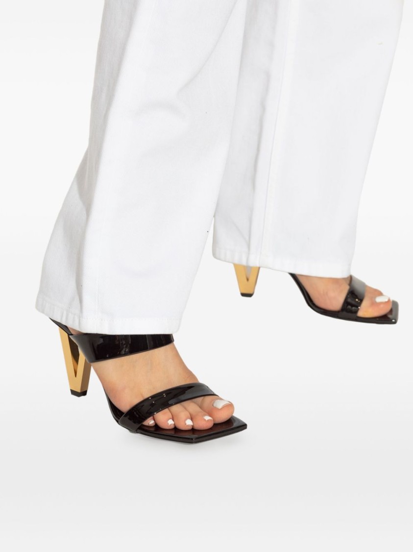 Shop Versace Patent Leather Mules With Galvanized V-shaped Heel In Black